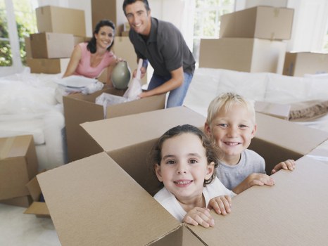 Removal team preparing household items for transport