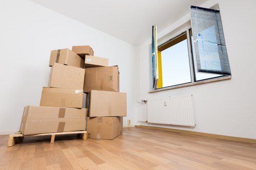 Packed office boxes and furniture ready for a business move