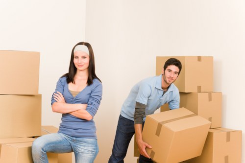 Driver helping load furniture for a local man and van service