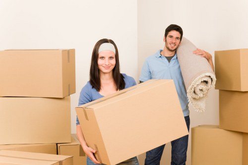 Packed boxes and furniture ready for removal truck hire